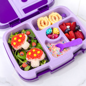 A purple bento style lunch box filled with food.